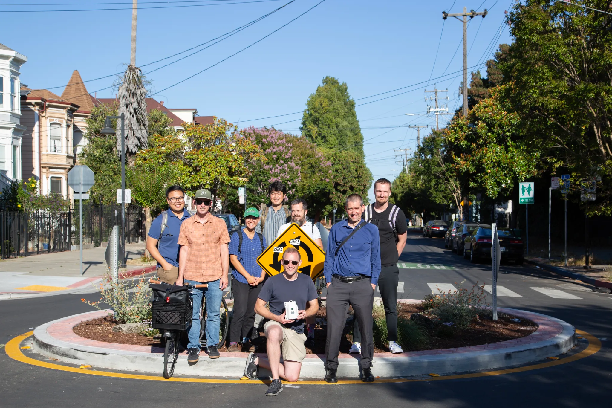 Standing in the circle on 8th and Chester with OakDOT project staff and Safe 8th Street volunteer Jesse Pollak, July 2024.