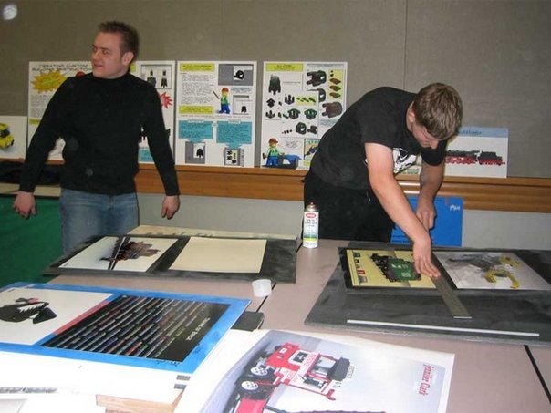 Mounting prints of renderings with Orion Pobursky at BrickFest PDX 2004.